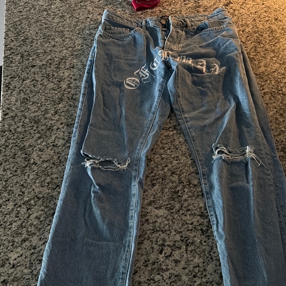 Boohoo man ripped jeans “ Official”